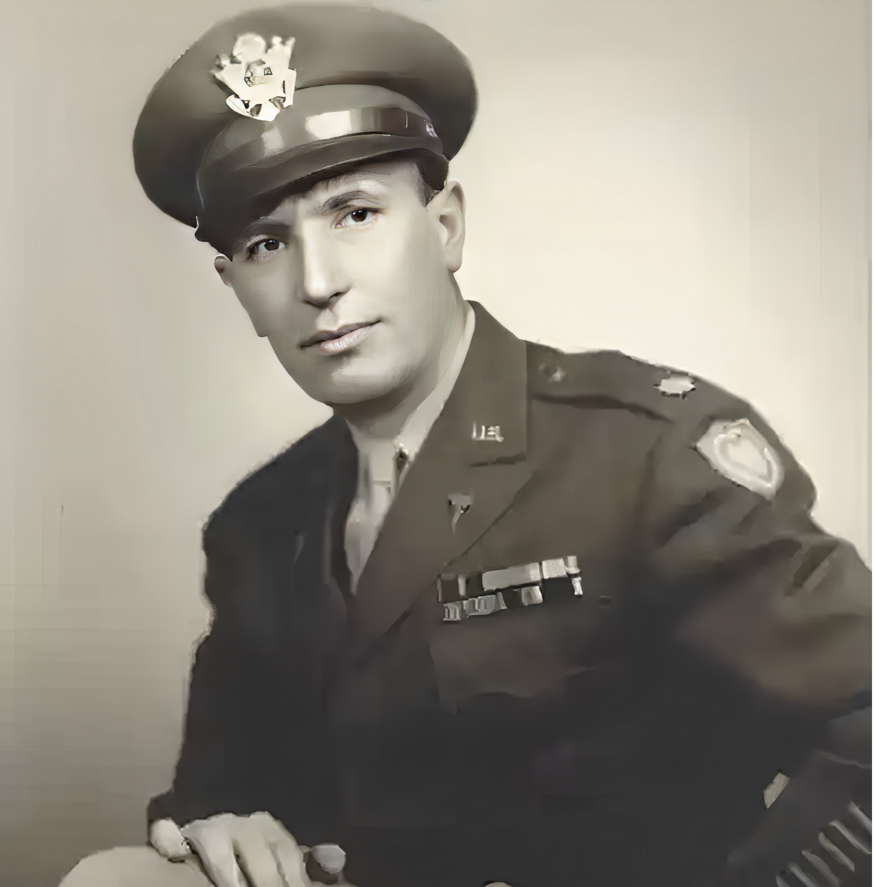 Man in military uniform, sepia-toned photograph.